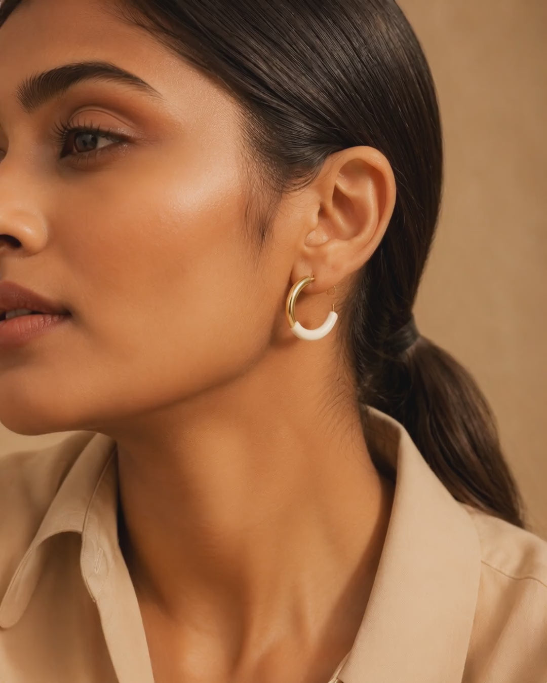 Swarneva stainless steel ivory enamel hoop earrings, 25mm x 25mm, wore by model in video