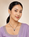 Swarneva Celeste Tie Set on North East Indian female model, silver-tone bow motif necklace and earrings with blue pear stones, necklace 115mm x 90mm and earrings 20mm x 22mm.