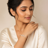 Indian female model wearing Flora Twine Bracelet in gold alloy, L48 x W54 mm, elegant studio pose.
