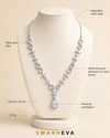 Swarneva Imperial Cadence Necklace displayed on a premium necklace mannequin, silver-tone necklace with white stones, teardrop pendant, dimensions 220 x 15 mm, weight 22.5 g