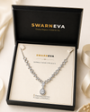 Swarneva Imperial Cadence Necklace presented inside premium branded jewelry box, silver-tone necklace with white stones and teardrop pendant, dimensions 220 x 15 mm