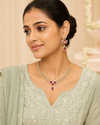 Swarneva Imperial Peony Set on Indian female model, gold-tone brass alloy necklace and earrings with ruby-pink stones, necklace 120mm x 140mm, earrings 42mm x 18mm.