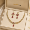 Swarneva Imperial Peony Set in premium jewelry box, gold-tone brass alloy set with ruby-pink stones, necklace 120mm x 140mm and earrings 42mm x 18mm.