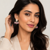 Middle Eastern model tucking hair, Swarneva Imperial Ruby full jacket earring – 3 rubies with diamond surrounds, 30mm drop