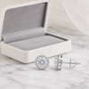 Swarneva Lumina Circle Earring spilling from pearl white box with silver-grey velvet interior on white marble