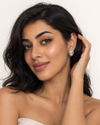 Swarneva Panther Ruby Eyes Stud – Middle Eastern model tucking hair, pink ruby eyes sparkle