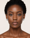 Swarneva Panther with Ruby Eyes Studs on African model – white gold, panther face with ruby eyes and white diamond studding