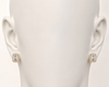 Gold square earrings on a mannequin ear