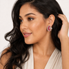 Latina model tucking hair, side view showing clip hinge behind ear, Swarneva ruby mosaic earrings sparkle