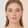 European model wearing Swarneva Royal Ruby Mosaic clip‑on earrings – leaf shape with pink rubies and white diamonds, 32x27mm
