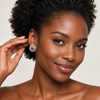African model tucking hair, Swarneva ruby lattice earring, red ruby glow and diamond sparkle