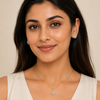 ndian female model wearing The Aurelia Set gold alloy hexagon pendant and earrings, 14 x 14 mm