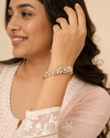 Swarneva The Baroque Motif Bracelet on Indian female model, gold alloy bracelet with cubic zirconia, 45 x 55 mm
