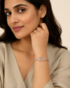 Indian female model wearing The Ceres Bracelet in gold alloy with rhodium detailing, 45 x 55 mm