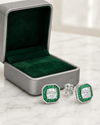 Swarneva Valencia Emerald Earring spilling from silver-grey box with emerald green velvet interior on white marble