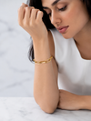 Swarneva Aura Linear Link Bracelet worn by Indian model wrist marble, gold rectangular paperclip chain editorial