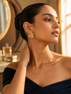 Swarneva Aura Vortex Studs worn by Indian model side profile, chunky gold spiral vortex earrings editorial