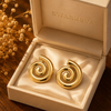 Swarneva Aura Vortex Studs in premium cream luxury jewelry gift box