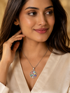 Swarneva Destiny Tree Evil Eye Silver Necklace worn by Indian model collarbone, silver tree evil eye pendant editorial