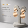 Swarneva Double Disc Drop Earrings mannequin catalog card, brushed rose gold double disc 48x28mm