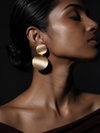 Swarneva Double Disc Drop Earrings worn by Indian model side profile, brushed rose gold double disc editorial