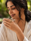 Swarneva Double Layer Emerald Baguette Ring worn by Indian model hand, gold double band emerald baguette ring editorial