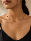 Swarneva Gold Double Layer Circle Necklace worn by Indian model collarbone, satellite choker and circle pendant editorial