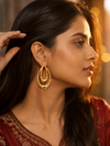 Swarneva Gold Hammered Double Teardrop Earrings worn by Indian model profile ear, hammered gold double teardrop editorial