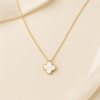 Swarneva Imperial Bloom White Clover Gold Necklace delicate white quatrefoil pendant on cable chain product photography