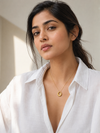 Swarneva Infiniti Arc Necklace worn by Indian model collarbone, chunky gold open circle pendant editorial