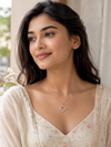 Swarneva Lumina Filigree Necklace worn by Indian model collarbone, rose gold filigree crystal pendant editorial