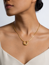 Swarneva Lumina Fluid U-Necklace worn by Indian model collarbone, chunky gold U pendant snake chain editorial