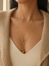 Swarneva Minimalist Ball Drop Y-Necklace worn by Indian model collarbone, Y-lariat gold ball drop editorial