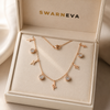 Swarneva Multi-Charm Snake Rose Gold Necklace in premium cream luxury jewelry gift box