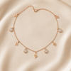 Swarneva Multi-Charm Snake Rose Gold Necklace multi-charm rose gold snake chain pendant product photography