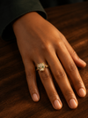 Swarneva Panther Green Eye Ring worn by Indian model hand dark surface, crystal panther green eyes ring editorial
