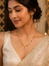 Swarneva Riviera Chevron Necklace worn by Indian model collarbone, pastel drop chevron pendant editorial