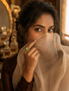 Swarneva Star Green Rotatable Flower Ring worn by Indian model hand, spinning green crystal bloom ring editorial