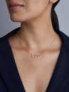 Swarneva Three Stone Slide Bar Necklace worn by Indian model collarbone, gold crystal horizontal bar editorial